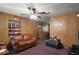 Cozy living room with wood paneling, and comfortable leather seating at 2155 Nw 27Th Ave, Ocala, FL 34475
