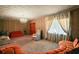 Bright living room with wood paneling, a window with curtains, and comfortable seating with carpeted floors at 2155 Nw 27Th Ave, Ocala, FL 34475
