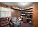 Office with built in wood shelving, and cozy arm chairs at 2155 Nw 27Th Ave, Ocala, FL 34475