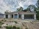 Charming home exterior featuring a two-car garage and stone accents at 2283 Sw 140Th Ct, Ocala, FL 34481