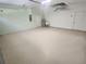 View of the home's spacious garage featuring neutral paint and ample floor space at 2283 Sw 140Th Ct, Ocala, FL 34481