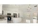 Bright, modern kitchen features stainless appliances, white cabinetry, and granite countertops at 2283 Sw 140Th Ct, Ocala, FL 34481