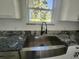 A stainless steel kitchen sink is adorned with granite countertops at 2283 Sw 140Th Ct, Ocala, FL 34481