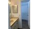 Updated bathroom with vanity and doorway to large walk-in closet at 3381 Nw 44Th Ct, Ocala, FL 34482