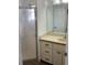 Bathroom featuring a shower with glass door, vanity with sink and cabinet storage space at 3381 Nw 44Th Ct, Ocala, FL 34482
