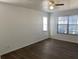 Bright bedroom with neutral walls, wood-look flooring, and two windows for ample natural light at 3381 Nw 44Th Ct, Ocala, FL 34482