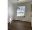 Dining area with new wood floors, pendant lighting, and a bright window at 3381 Nw 44Th Ct, Ocala, FL 34482