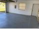 A spacious two car garage with painted floors and plenty of storage at 3381 Nw 44Th Ct, Ocala, FL 34482