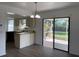 Bright kitchen area featuring sliding glass doors to the backyard, providing natural light and scenic views at 3381 Nw 44Th Ct, Ocala, FL 34482