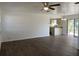 Open living room with wood-look floors and neutral tones, flowing into the adjacent kitchen at 3381 Nw 44Th Ct, Ocala, FL 34482