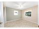 Bedroom with light colored walls, tile flooring, and large windows at 3515 Ne 43Rd Pl, Ocala, FL 34479