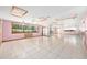 The bright bonus room features tile flooring, ceiling fans, and ample natural light at 3515 Ne 43Rd Pl, Ocala, FL 34479