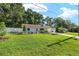 Well-maintained single-story home with landscaped yard and a charming picket fence at 3515 Ne 43Rd Pl, Ocala, FL 34479