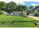 Well-maintained single-story home with landscaped yard and a charming picket fence at 3515 Ne 43Rd Pl, Ocala, FL 34479