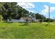 Well-maintained single-story home with landscaped yard and a charming picket fence at 3515 Ne 43Rd Pl, Ocala, FL 34479