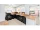 Well-lit kitchen showcasing ample countertop space and stainless steel appliances at 3515 Ne 43Rd Pl, Ocala, FL 34479