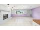 Bright living room with a fireplace, large window, and plenty of space at 3515 Ne 43Rd Pl, Ocala, FL 34479