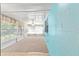 This sunroom offers brick walls and multiple windows with natural light and tiled floors at 3515 Ne 43Rd Pl, Ocala, FL 34479