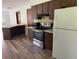 Spacious kitchen featuring updated appliances, dark cabinetry, and a bright and efficient workspace at 4701 Ne 9Th St, Ocala, FL 34470