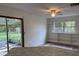 Comfortable open layout with a combination kitchen and living room leading to a screened in porch and built in shelving at 4701 Ne 9Th St, Ocala, FL 34470