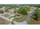 An aerial view of a charming home with solar panels nestled in a serene neighborhood at 51 Pine Trace Loop, Ocala, FL 34472