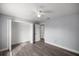 Bedroom with closet, ceiling fan, and light gray walls at 51 Pine Trace Loop, Ocala, FL 34472