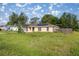 Inviting single-story home with a well-manicured lawn, features solar panels, and fenced backyard for privacy at 51 Pine Trace Loop, Ocala, FL 34472