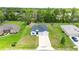Aerial shot of a well-maintained single-Gathering home with a spacious yard and a two-car garage at 5239 Sw 114Th Street Rd, Ocala, FL 34476