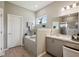 Relaxing bathroom with a soaking tub, tiled surround, and natural light at 5239 Sw 114Th Street Rd, Ocala, FL 34476
