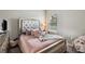 Bedroom with decorative pillows on bed frame at 5239 Sw 114Th Street Rd, Ocala, FL 34476