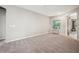 Spacious bedroom with large window for natural light and neutral carpet at 5239 Sw 114Th Street Rd, Ocala, FL 34476