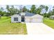 Charming single-story home featuring a two-car garage and well-maintained landscaping at 5239 Sw 114Th Street Rd, Ocala, FL 34476