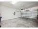 Spacious two-car garage with concrete flooring, providing ample parking and storage at 5239 Sw 114Th Street Rd, Ocala, FL 34476