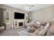 Inviting living room with entertainment center, large TV, and comfortable seating at 5239 Sw 114Th Street Rd, Ocala, FL 34476