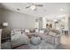 Open living room showcases a large sectional sofa and stylish decor at 5239 Sw 114Th Street Rd, Ocala, FL 34476