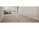 Open-concept living room featuring neutral carpet and inviting spaces at 5239 Sw 114Th Street Rd, Ocala, FL 34476