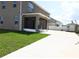 View of backyard with a screened-in porch, shed, and a concrete patio space at 5962 Sw 80Th Ln, Ocala, FL 34476