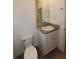 Bathroom featuring granite counters, white cabinets, modern sink, and tiled floors at 5962 Sw 80Th Ln, Ocala, FL 34476