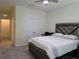 Bedroom featuring a modern bed, ceiling fan, and closet at 5962 Sw 80Th Ln, Ocala, FL 34476