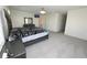 Comfortable bedroom featuring a queen-sized bed and lots of open space at 5962 Sw 80Th Ln, Ocala, FL 34476