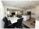 Open-concept dining area flowing into a modern kitchen and inviting living room at 5962 Sw 80Th Ln, Ocala, FL 34476