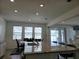 Open-concept kitchen featuring granite countertops, modern lighting, and a view into the living area at 5962 Sw 80Th Ln, Ocala, FL 34476