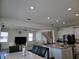 Open living room, dining area, and kitchen with white cabinetry at 5962 Sw 80Th Ln, Ocala, FL 34476