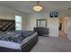 A spacious main bedroom is decorated with elegant grey furniture and modern lighting, creating a restful retreat at 5962 Sw 80Th Ln, Ocala, FL 34476