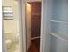 View of the hallway, toilet and closet with open door at 6141 Nw 64Th Ct, Ocala, FL 34482