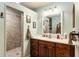 Bathroom with a wood vanity, tile floors, and a tiled walk-in shower at 7563 Nw 21St St, Ocala, FL 34482