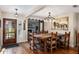 Dining room with a rustic table, sliding barn doors and fireplace at 7563 Nw 21St St, Ocala, FL 34482
