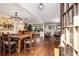 Open dining room featuring a large wooden table and chairs and hardwood floors at 7563 Nw 21St St, Ocala, FL 34482