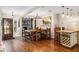 Well-lit dining room featuring a rustic chandelier and hardwood flooring at 7563 Nw 21St St, Ocala, FL 34482