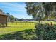 Picturesque view of a sprawling equestrian estate with horses grazing in a fenced pasture at 7563 Nw 21St St, Ocala, FL 34482